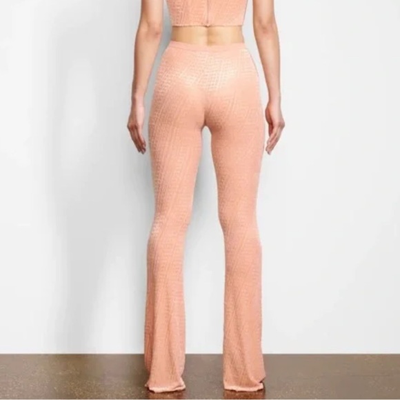 Skims After Hours Velvet Logo Flare Leggings Pants in Peach - Picture 2 of 4